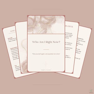 May include: A deck of cards with a soft beige and dusty rose color palette. The central card features the text Who Am I Right Now? and find yourself again, one question at a time. The top of the card displays an abstract marble pattern.