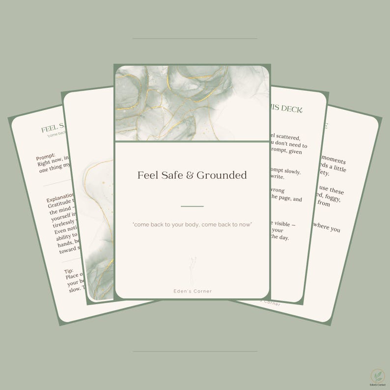 May include: A set of rectangular cards with rounded corners, featuring a sage green and white abstract ink wash design with gold accents. The central card displays the text Feel Safe & Grounded and come back to your body, come back to now.