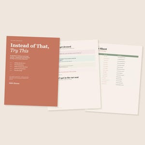May include: Three sheets of paper with text. The first sheet is a burnt orange color and reads "Instead of That, Try This." The other two sheets are white with text in black. The background is a solid, light beige color.