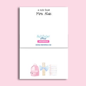 May include: A white notepad featuring the text a note from Mrs. Alex at the top. The centre displays the Saltwater Press logo and website. The bottom section shows a watercolour illustration of a pink backpack, a wooden ruler with a blue bow, and a lined paper.