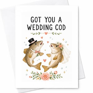 Może przedstawiać: Biała kartka okolicznościowa z napisem GOT YOU A WEDDING COD. Ilustracja przedstawia dwie ryby w strojach ślubnych, jedna w czarnym cylindrze i różowej muszce, druga w białym welonie i naszyjniku z pereł, otoczone motywami kwiatowymi.