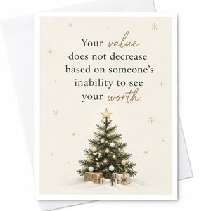 May include: A greeting card with a cream background featuring the text Your value does not decrease based on someone's inability to see your worth. Below the text is a decorated Christmas tree with a gold star and wrapped gifts at the base.