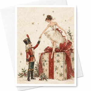 Peut inclure: Une illustration de carte de vœux montrant un casse-noisette en uniforme rouge et vert tenant la main d'une ballerine en tutu blanc. La ballerine se tient sur un grand cadeau emballé avec un large ruban rouge et un nœud, entourée d'étoiles dorées.
