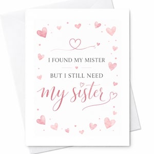 May include: A white greeting card featuring the text I FOUND MY MISTER BUT I STILL NEED my sister in black and pink script fonts. The design is decorated with various small pink watercolor hearts and dots scattered around the central text.