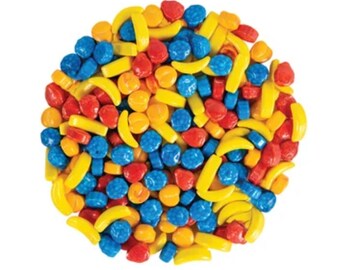 May include: A close-up of a pile of colorful candy sprinkles. The sprinkles are shaped like fruit slices and bananas. The colors are yellow, red, and blue.