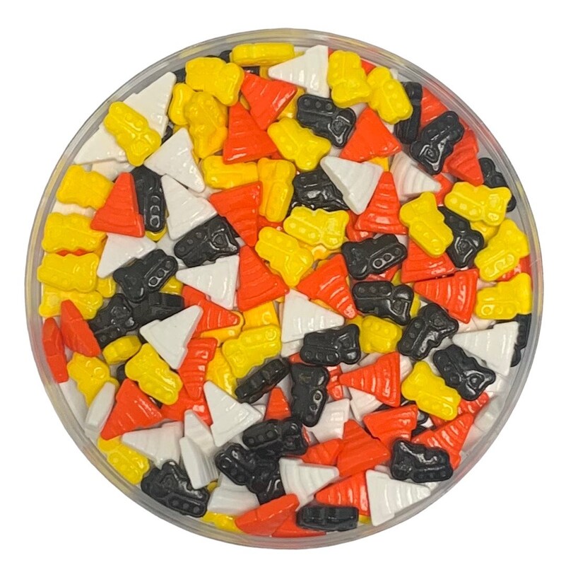 May include: A bowl of colorful sprinkles in the shape of traffic cones and construction vehicles. The sprinkles are in shades of orange, yellow, black, and white.