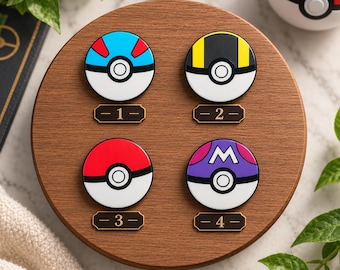 May include: Four circular pins featuring distinct color patterns and a central button design, arranged on a round wooden display. Pin 1 is blue, red, and white. Pin 2 is black, yellow, and white. Pin 3 is red and white. Pin 4 is purple, pink, and white with an M symbol.