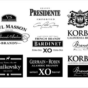 May include: A collection of black and white brandy labels, including "Paul Masson," "Korbel," and "Bardinet." The labels feature various fonts and designs, with some including text like "Extra Old" and "California Brandy."