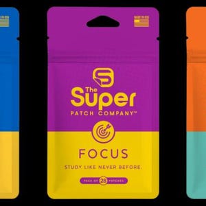 May include: Three colorful pouches from The Super Patch Company. The pouches are blue, purple, and orange, each with a different word: DEFEND, FOCUS, and VICTORY. Each pouch has a different icon and the text "PROTECT YOUR HEALTH LIKE NEVER BEFORE", "STUDY LIKE NEVER BEFORE", and "ATHLETIC PERFORMANCE LIKE NEVER BEFORE".