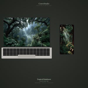 May include: A desktop and phone set featuring a tropical rainforest scene. The computer screen and phone display a lush green forest with sunlight streaming through the trees. The keyboard is light gray with black keys. The text "Tropical Rainforest" is visible.