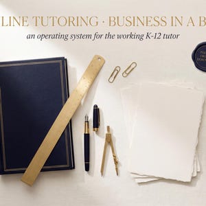 May include: A dark blue notebook with gold trim, a gold ruler, two gold paper clips, a fountain pen, a gold drafting compass, a stack of white paper, and a gold mechanical pencil. Text reads: ONLINE TUTORING BUSINESS IN A BOX an operating system for the working K-12 tutor.