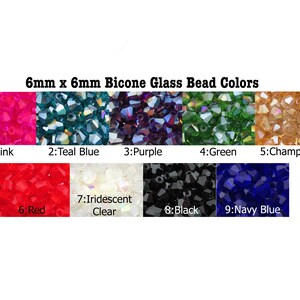 May include: A chart showing 9 different colors of 6mm x 6mm bicone glass beads. The colors are pink, teal blue, purple, green, champagne, red, iridescent clear, black, and navy blue.