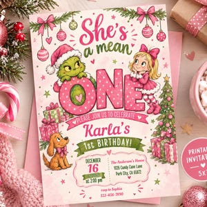 May include: A rectangular birthday invitation card featuring a green character in a Santa hat, a blonde girl in a pink dress, and a brown dog. The text reads: She's a mean ONE, Please join us to celebrate Karla's 1st Birthday, December 16 at 2:00 pm, The Anderson's House, 1026 Candy Cane Lane, Park City, CA 65872, rsvp to Sephia 123-456-7890.