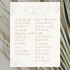 May include: A cream-colored Summer Bucket List printable featuring a list of activities with seashell bullet points. The text includes items like host a girls night, find a cool shell, watch the sunrise, movie night, and bake a cake in brown script.