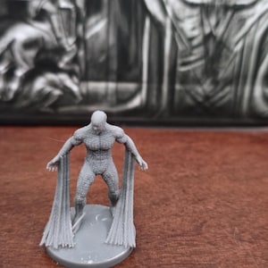 May include: A set of three ceramic mugs with a speckled, matte finish. The mugs are in shades of cream, light gray, and dark gray. Each mug has a simple, minimalist design, perfect for coffee or tea.