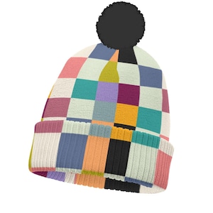 May include: A knit beanie featuring a multicolored checkerboard pattern in shades of pink, blue, teal, yellow, purple, orange, and black. The hat includes a ribbed cuff and a large, solid black pom-pom attached to the top center of the crown.