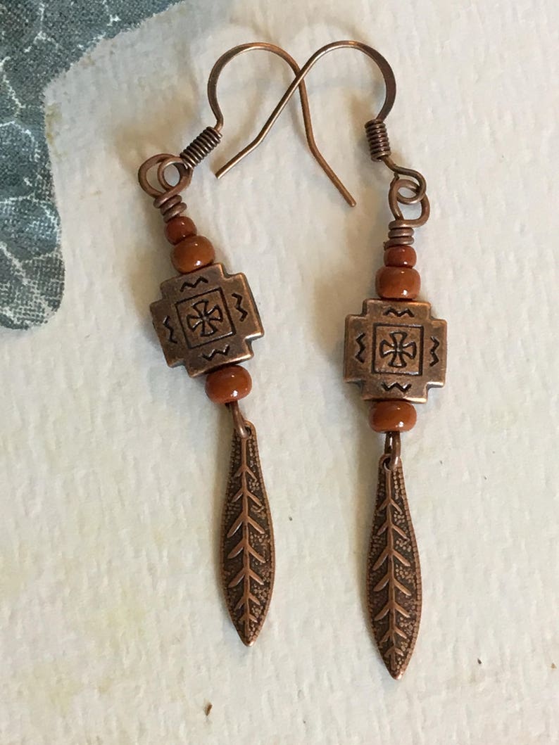 Dark orange/adobe tribal dangle earrings. image 1