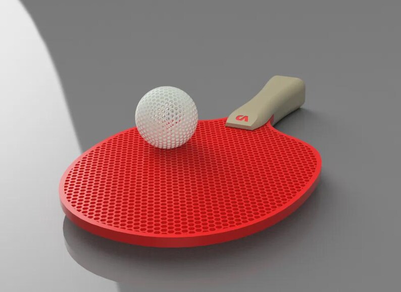May include: A red ping pong paddle with a beige handle and a white ball. The paddle has a honeycomb pattern on its surface. The handle has the letter "CA" in red. The ball is white and has a perforated design.
