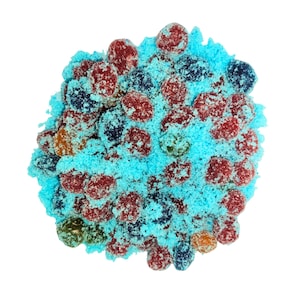 May include: A collection of colourful sweets, including red, blue, and orange, covered in a bright blue powder. The sweets are arranged in a circular shape against a white background, creating a visually appealing treat.