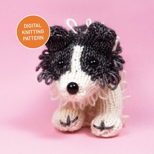 May include: A knitted black and white border collie dog toy. The dog is sitting on a pink background. The toy is made with white yarn and black yarn. The dog has black eyes and a black nose.