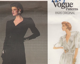May include: Vogue Patterns 1799 Paris Original sewing pattern for a dress by Emanuel Ungaro. The pattern features two views of a dress, one in black and one in white.