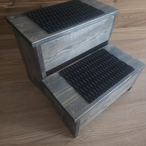 May include: A set of three ceramic mugs with a speckled, matte finish. The mugs are in shades of cream, light gray, and dark gray. Each mug has a simple, minimalist design, perfect for coffee or tea.