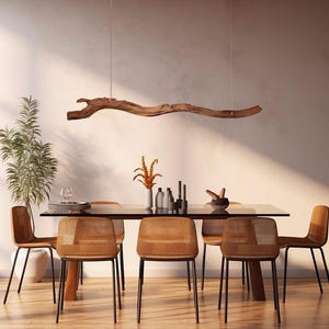 May include: A modern dining room set with a glass table, six chairs, and a wooden branch light fixture. The chairs have brown woven seats and black metal legs. Decorative vases and candles are on the table.