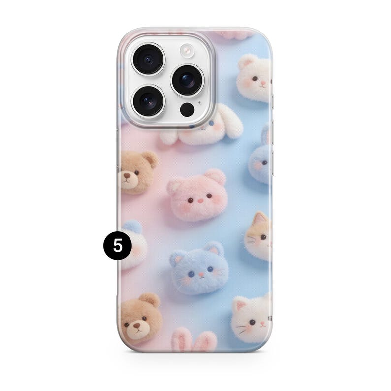 May include: A smartphone case featuring a gradient background transitioning from soft pink to light blue. The surface is decorated with a repeating pattern of small, fuzzy, plush-like animal faces including bears, cats, and bunnies. A black circle with the number 5 is visible on the left side.