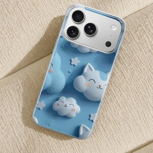 May include: A clear smartphone case featuring a light blue background with raised, three-dimensional cartoon clouds and cat-shaped cloud characters. The design includes small white flower shapes and a triple-lens camera cutout at the top.