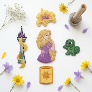 May include: A collection of five embroidered patches featuring a golden flower, a tall tower with long blonde hair, a character with long blonde hair in a purple dress, a green chameleon, and a yellow lantern with a sun design, surrounded by flowers.