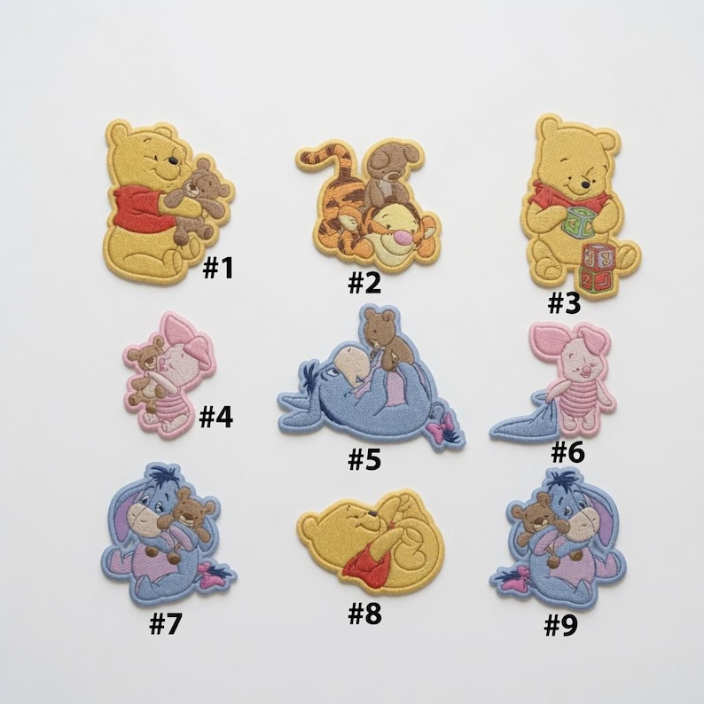 May include: A collection of nine embroidered fabric patches featuring Winnie the Pooh characters including Pooh, Tigger, Piglet, and Eeyore, each labeled with a black number from one to nine, showcasing various poses with small brown teddy bears.