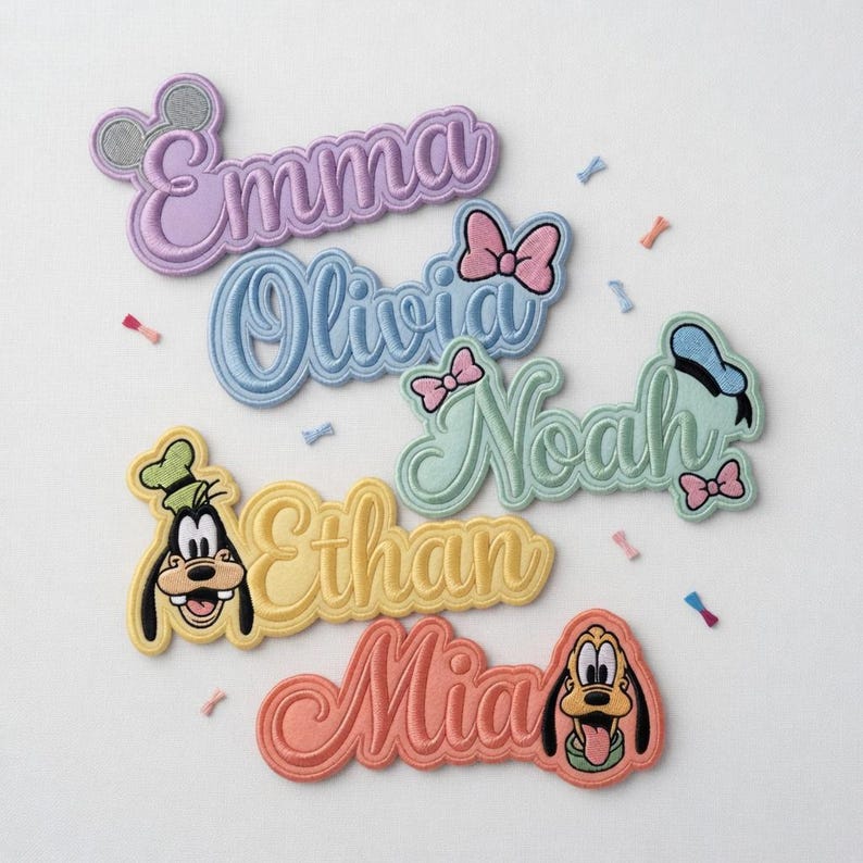 May include: Embroidered name patches in pastel colors, featuring names like Emma, Olivia, and Noah. Each patch includes a Disney character or accessory, such as Mickey Mouse ears or a bow. Ideal for personalizing clothing or accessories.