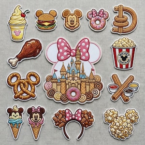 May include: A selection of colourful Disney-themed patches showcasing food and characters. Includes a Mickey Mouse ice cream cone, a burger, a popcorn bucket, a castle, and a pretzel.
