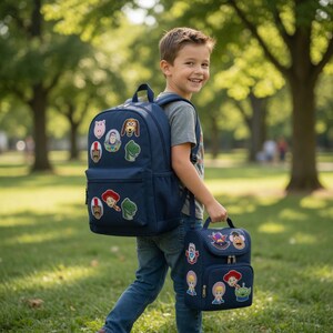 May include: A navy blue backpack and a matching navy blue lunch bag, both decorated with various colorful character patches from the Toy Story film franchise. The backpack features a large main compartment and a front pocket, while the lunch bag has a top handle and a zippered front pocket.