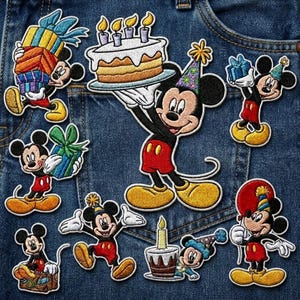 May include: A collection of embroidered Mickey Mouse patches in various poses, celebrating a birthday. Mickey is holding gifts, a cake with candles, and a balloon. The patches are in red, black, yellow, and white, with blue and green accents, set against a denim background.