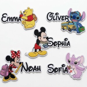 May include: Five embroidered patches featuring cartoon characters and names. Winnie the Pooh with 'Emma', Stitch with a school bus and 'Oliver', Mickey Mouse holding books with 'Sophia', Minnie Mouse with a backpack and 'Noah', and Angel with 'Sofia'.