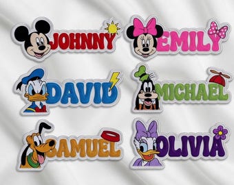 May include: Embroidered name patches featuring Disney characters Mickey Mouse, Minnie Mouse, Donald Duck, Goofy, Pluto, and Daisy Duck. Each patch has a name in a different color, such as red, pink, blue, green, orange, and purple.