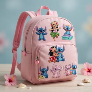May include: A pink backpack decorated with embroidered Stitch and Lilo characters. The backpack has a main compartment, a front pocket, and adjustable straps. The zips have heart-shaped pulls. Hibiscus flowers and seashells are in the foreground.