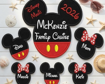 May include: A collection of black and red embroidered patches shaped like Mickey Mouse heads. The large central patch features the text Disney Magic, 2026, McKenzie Family Cruise. Smaller patches are personalized with the names Dad, Mom, Maddie, Michael, and Katie.