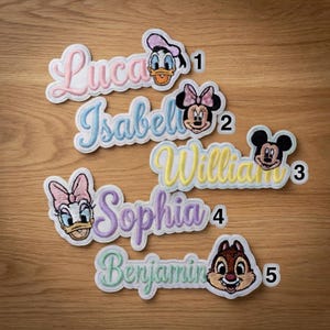 May include: Embroidered name patches featuring Disney characters. The patches include names like Lucas, Isabel, William, Sophia, and Benjamin, each with a corresponding character such as Donald Duck, Minnie Mouse, and Mickey Mouse. The patches have a white border and are in various pastel colors.