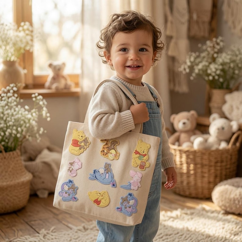 May include: A beige canvas tote bag featuring multiple embroidered patches of Winnie the Pooh characters, including Pooh, Piglet, Tigger, and Eeyore. The patches are arranged across the front of the bag, showcasing various poses of the characters.