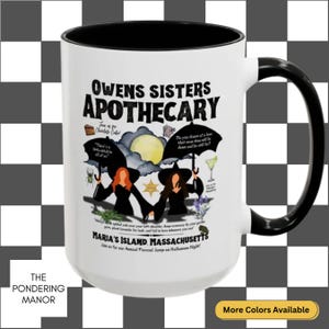 May include: White ceramic mug with a black interior and handle. The mug features the text "OWENS SISTERS APOTHECARY" with illustrations of witches, a moon, and text. The bottom of the mug reads "MARIA'S ISLAND, MASSACHUSETTS".