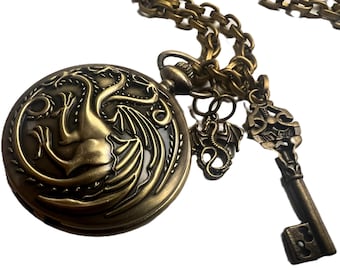 Brass colored Steampunk hydra dragon pocket watch with Miniature dragon and key charm.