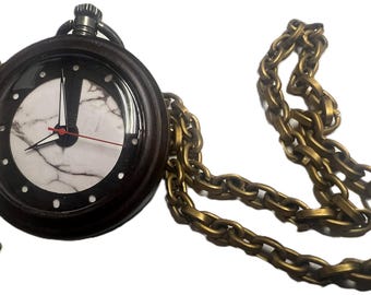Steampunk Pocket watch with key. White marble pattern center.