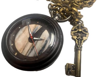 Dark Brown Wood color Steampunk Pocket watch with key. Marble design center.
