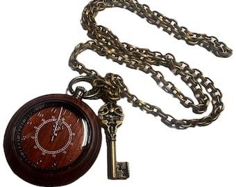 Dark Brown Wood color Steampunk Pocket watch with key. Cherry color center.