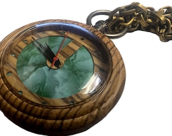 Steampunk Pocket watch with key. jade color pattern center.