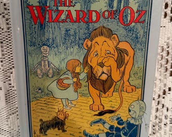 The Wizard of Oz hardcover book by L. Frank Baum, illustrated by W. W. Denslow. This is a 1999 reprint.