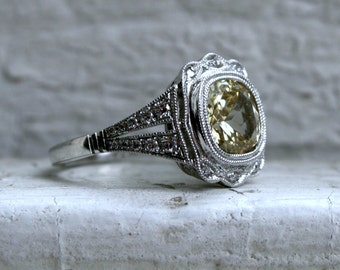 Natural Yellow Sapphire and Diamond Halo Engagement Ring in Platinum.