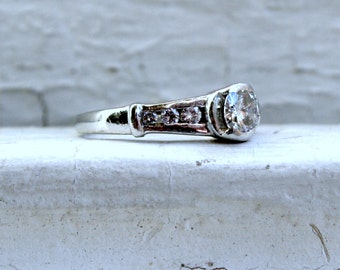 Vintage Platinum Channel Diamond Engagement Ring - 0.68ct.